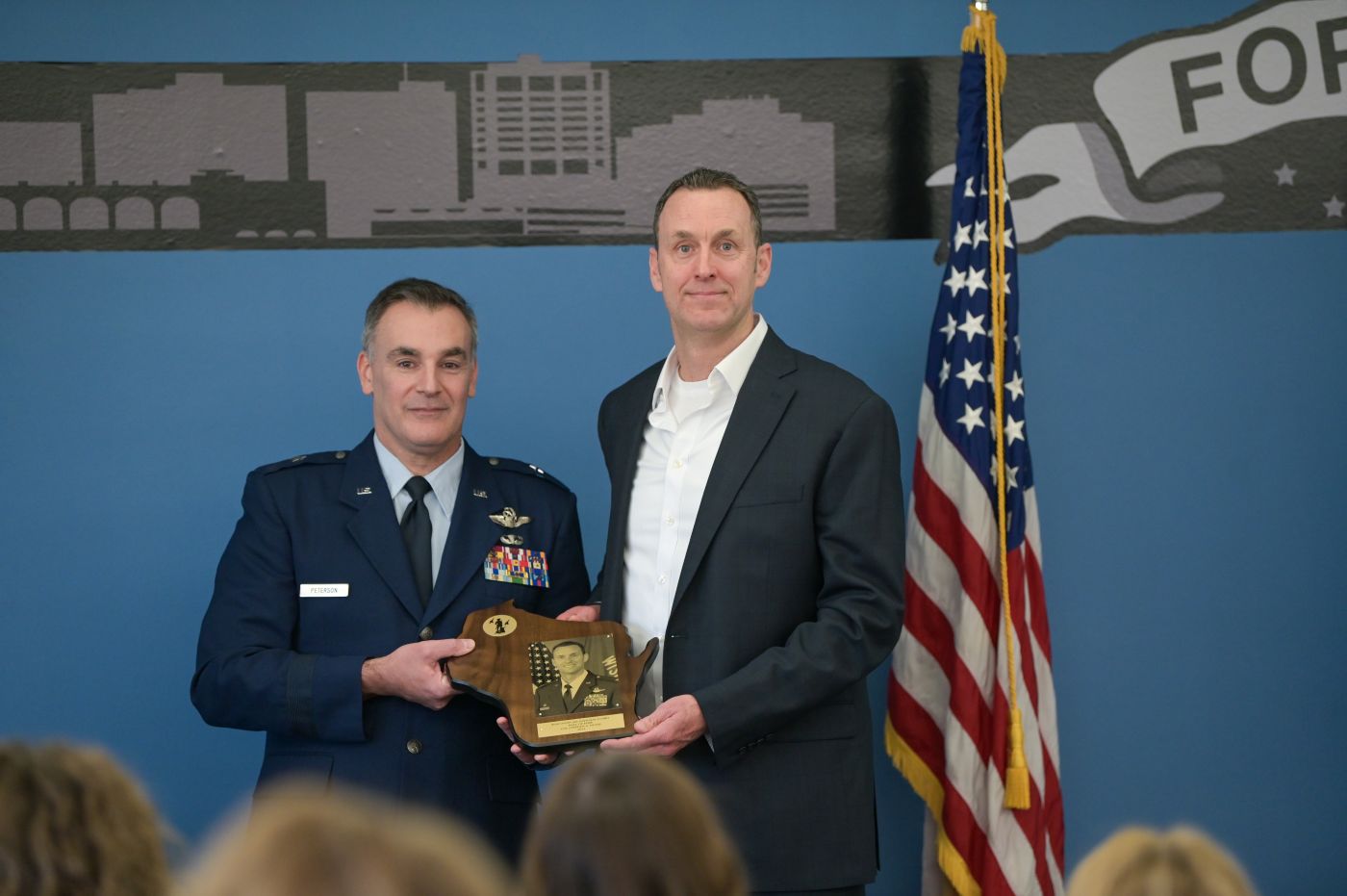 U.S. Air Force Brig. Gen. Erik Peterson, Wisconsin’s interim deputy adjutant general for Air, inducts retired Col. Stephen Dunai into the Wisconsin Air National Guard Hall of Fame Jan. 31, 2025 at Truax Field in Madison, Wisconsin. The Hall of Fame program was established in 1982 to honor the special contributions Air National Guard members make to the overall success of the Wisconsin National Guard mission. (U.S. Air National Guard photo by Tech. Sgt. Cameron Lewis)